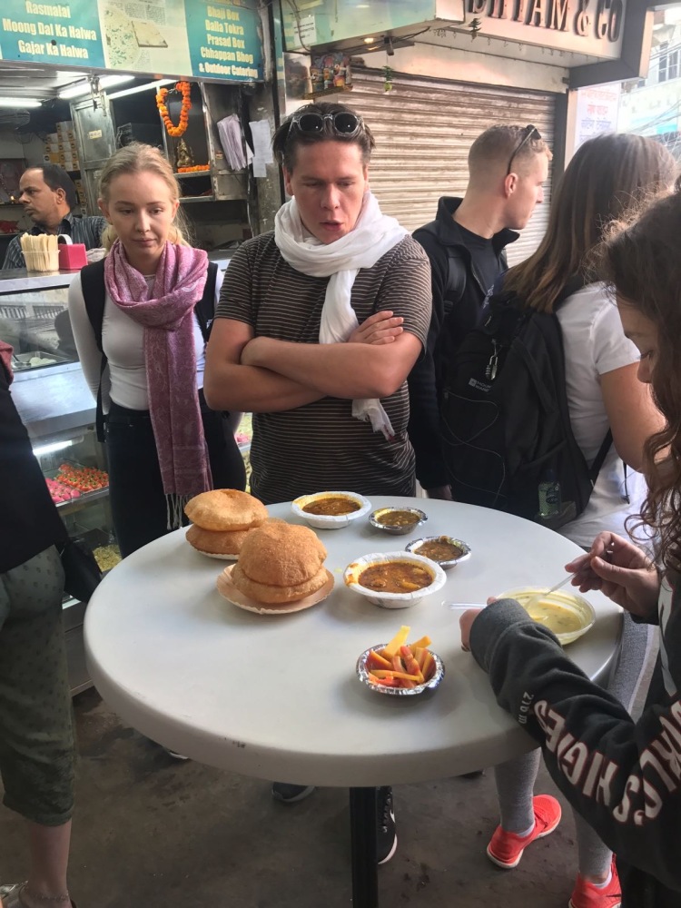 People eating on Delhi food tour